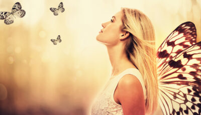 Beautiful young woman with butterfly wings